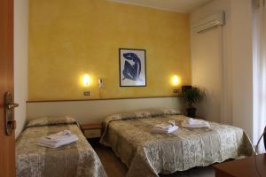 Ένα ή περισσότερα κρεβάτια σε δωμάτιο στο Hotel Arabesco +37 φωτογραφίες