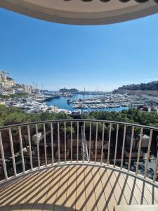 a balcony with a view of a harbor at Luxurious accommodation on the Grand Prix track in Monte Carlo
