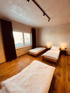 A bed or beds in a room at Kerkira pub&restaurant