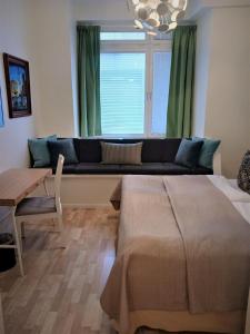 a living room with a couch and a table at Hotel Hornsgatan in Stockholm