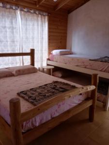 a bedroom with two bunk beds and a window at Casa en Federación in Federación