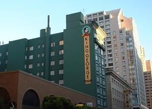 a tall building with a clock on the top of it at King George in San Francisco
