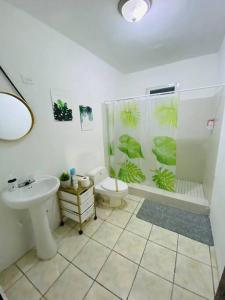 a bathroom with a sink and a toilet and a shower at 3BR spacious, dorado beach apartment, -20% monthly in Dorado