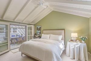 a bedroom with a bed and a table with a lamp at 3884 Twenty-One Oaks home in Carmel
