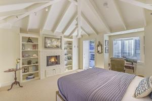a bedroom with a bed and a fireplace at 3884 Twenty-One Oaks home in Carmel