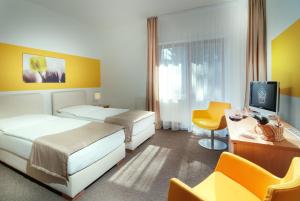 Postel nebo postele na pokoji v ubytování Hotel VZ Bedřichov