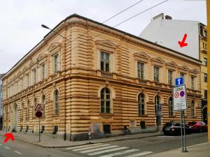 a wooden building on the side of a street at Luxury Design City centre Apartment in Brno