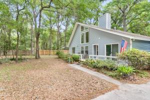 a blue house with an american flag on it at Beaufort 2 Blythewood Road in Beaufort