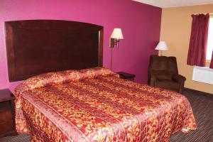 Postel nebo postele na pokoji v ubytování Asteria Inn & Suites Stillwater