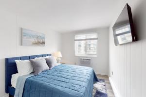 Ένα ή περισσότερα κρεβάτια σε δωμάτιο στο Colonial Condo 305