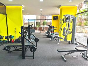 a gym with a bunch of treadms and machines at 415 - Rentaqui - Flat Jardins Residence Confort in Sao Paulo