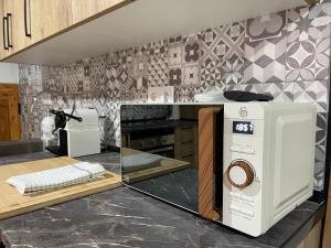 a kitchen with a washing machine on a counter at Loft Playa Villajoyosa in Villajoyosa