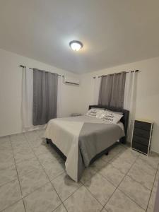 a bedroom with a bed in a room at Boqueron el “Carribe” “paradise” in Cabo Rojo