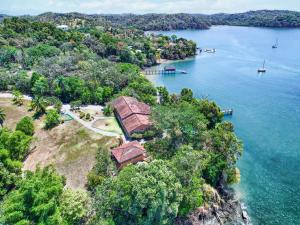 an aerial view of a house on an island in the water at Gone Fishing Panama Resort in Boca Chica