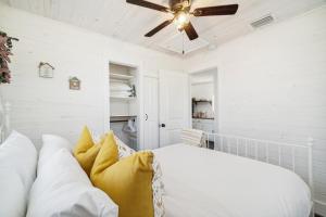 a bedroom with a bed and a ceiling fan at Casa de la Playa - 2 Bedroom Beach House in Panama City Beach