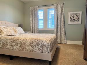 a bedroom with a bed and a window at Just like home in North Platte