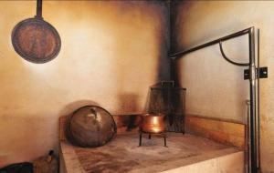 a corner of a room with a pot and a lamp at House Fun&Relax in Šestanovac