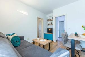 a living room with a couch and a table at House Fun&Relax in Šestanovac +83 photos
