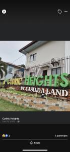 a picture of a building with a sign on it at My Humble Home in Dipolog