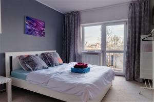 a bedroom with a bed and a window at Parliament Merlot Unirii Square 5 Bedrooms Luxury Apartment Old Town in Bucharest