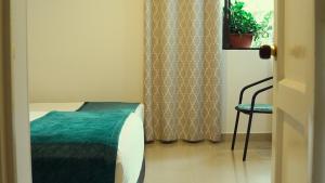 Postel nebo postele na pokoji v ubytování Hotel Campestre Villa Mary