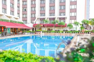 a swimming pool in front of a hotel at China Hotel Guangzhou in Guangzhou