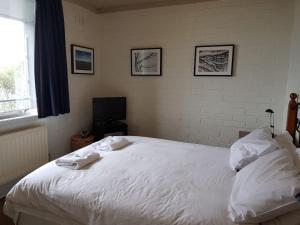 Ένα ή περισσότερα κρεβάτια σε δωμάτιο στο Snowflake 14