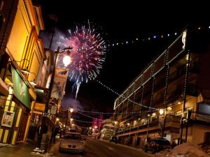 a firework display on a city street at night at Treasure Mountain Inn in Park City