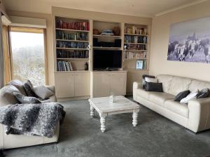 a living room with a couch and a coffee table at Mawson 5 in Mount Buller