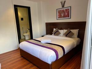 Ένα ή περισσότερα κρεβάτια σε δωμάτιο στο Hotel New Era