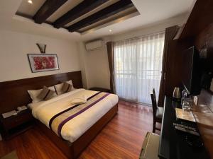 Ένα ή περισσότερα κρεβάτια σε δωμάτιο στο Hotel New Era