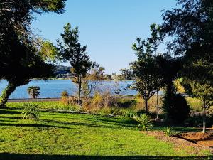 a park with a view of a body of water at Diamond Retreat in Tairua