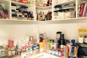 a pantry filled with lots of food and drinks at Kelburn House at the top of the Cable Car in Wellington