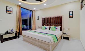Letto o letti in una camera di Treebo Ortus Residency