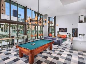 a living room with a pool table in it at Top Floor High Rise 3 Bed DTLA Skyscraper Penthouse in Los Angeles