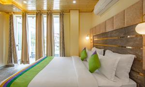 Letto o letti in una camera di Treebo Ortus Residency