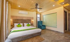 Letto o letti in una camera di Treebo Ortus Residency