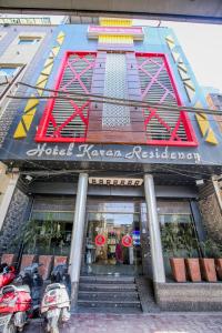 a hotel korean restaurant sign on the front of a building at Hotel Karan Residency Amritsar - Golden Temple in Amritsar