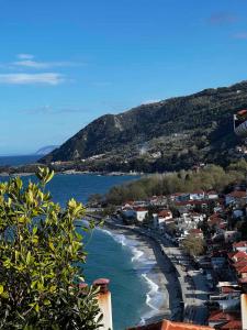 a view of a beach with houses and the ocean at Valenthia in Agios Ioannis Pelio