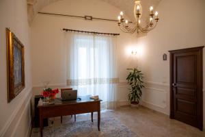 a room with a desk with a laptop on it at Corcioli B&B in Mesagne