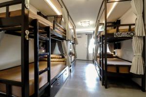 a room with a bunch of bunk beds at Cat Ba SOL Beach in Cat Ba +41 photos