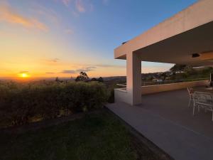 a sunset from the roof of a house at Soleada in Gijón