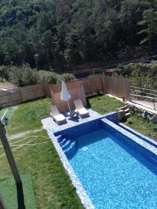 Der Swimmingpool an oder in der Nähe von 4 Sleeps, Villa in Nature with Private Pool in Faralya Fethiye - AWZ 238