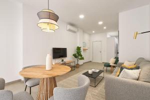 A television and/or entertainment centre at Soho Apartments in Malaga by Solaga Holiday Homes