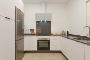 A kitchen or kitchenette at Soho Apartments in Malaga by Solaga Holiday Homes