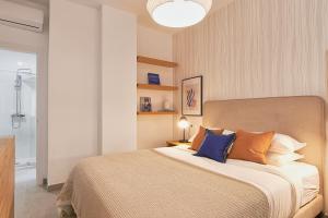 A bed or beds in a room at Soho Apartments in Malaga by Solaga Holiday Homes