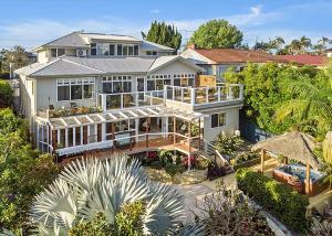 an aerial view of a large house with a large deck at Garden Spa Villa in Coffs Harbour