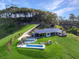 an aerial view of a house with a swimming pool at Ciao Korora in Coffs Harbour