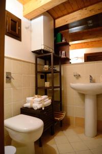 a bathroom with a toilet and a sink at Alla Corte dei Ventimiglia in Montelepre