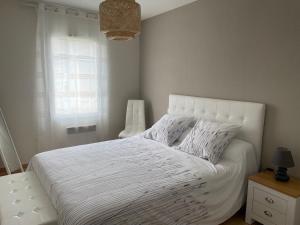 Postel nebo postele na pokoji v ubytování Le Lotois les Ondines + 27 fotografií